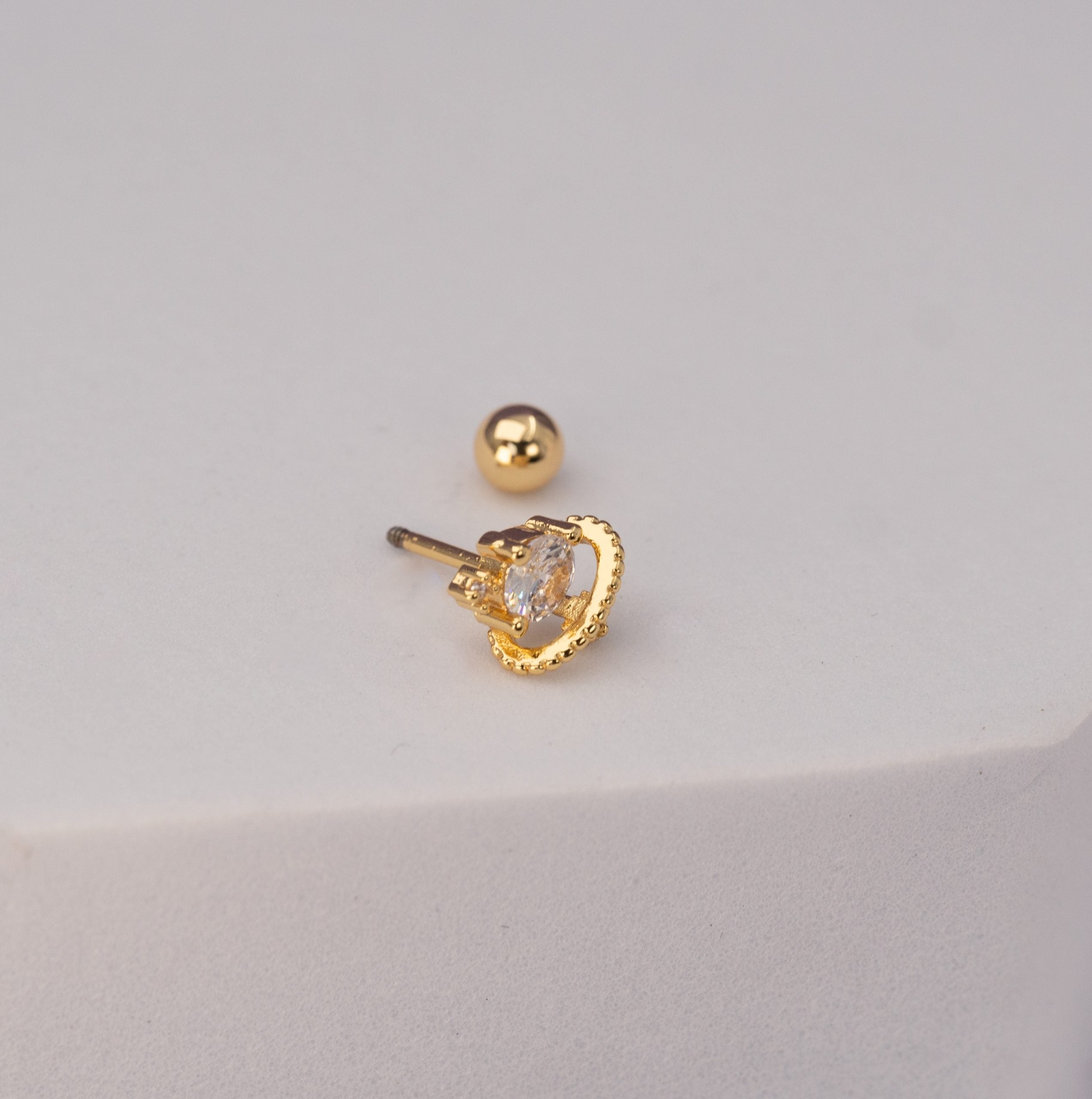 Piercing Planeta Dorado