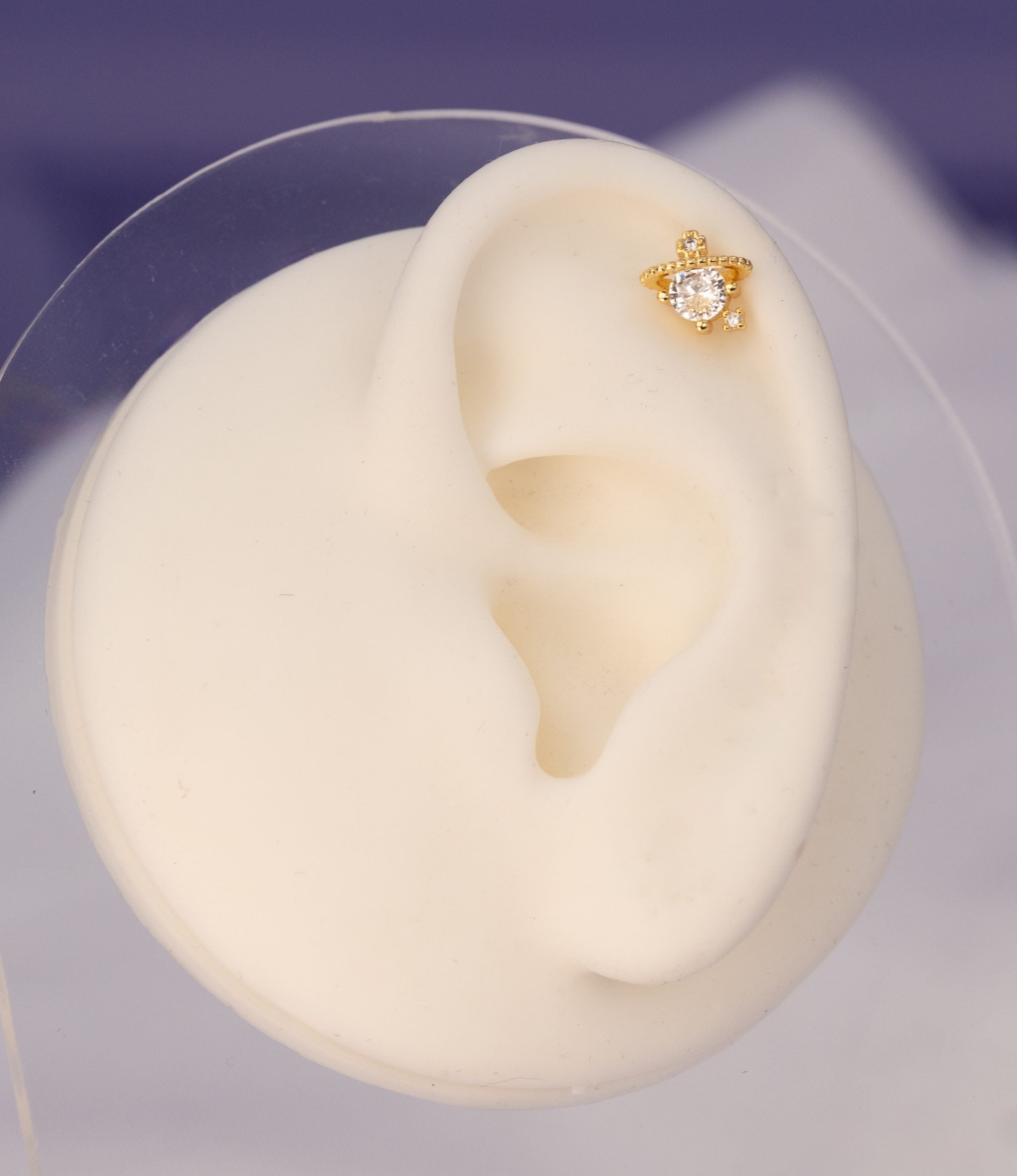 Piercing Planeta Dorado