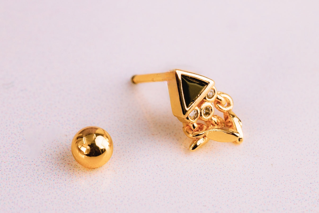 Piercing Triángulo Atrapasueños